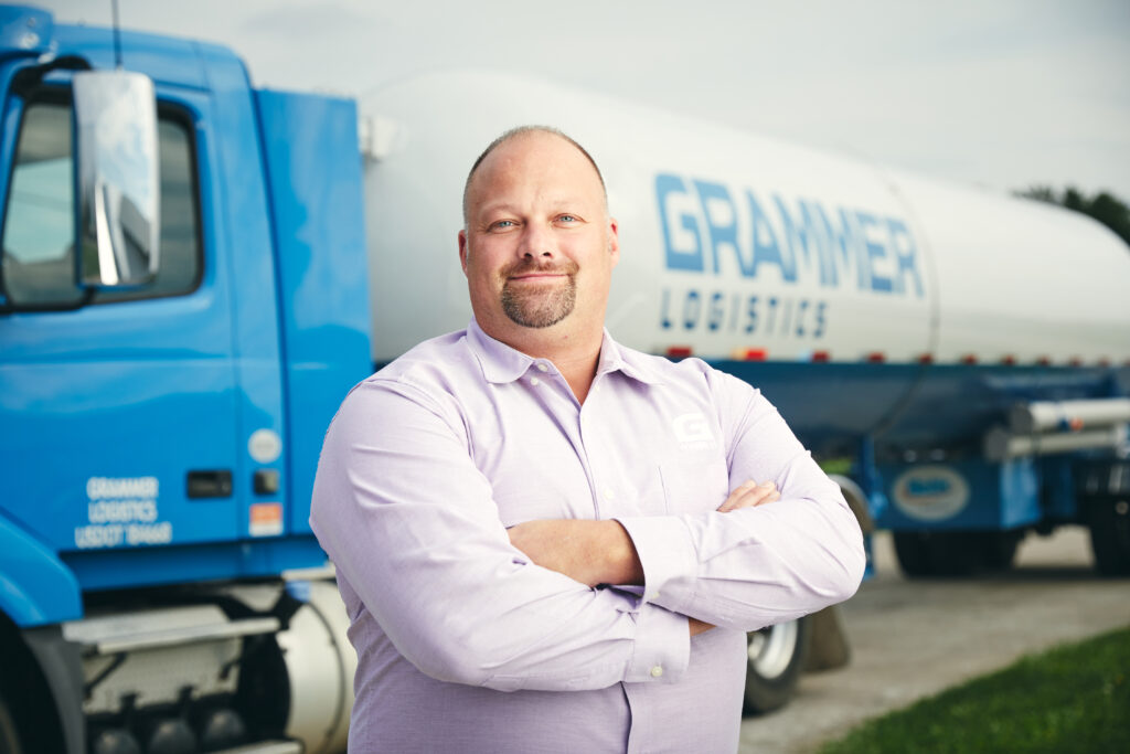 Tony Shinn standing beside Grammer Logistics' 331 NGL transport trailer, showcasing the company's commitment to specialized and safe natural gas liquid transportation.